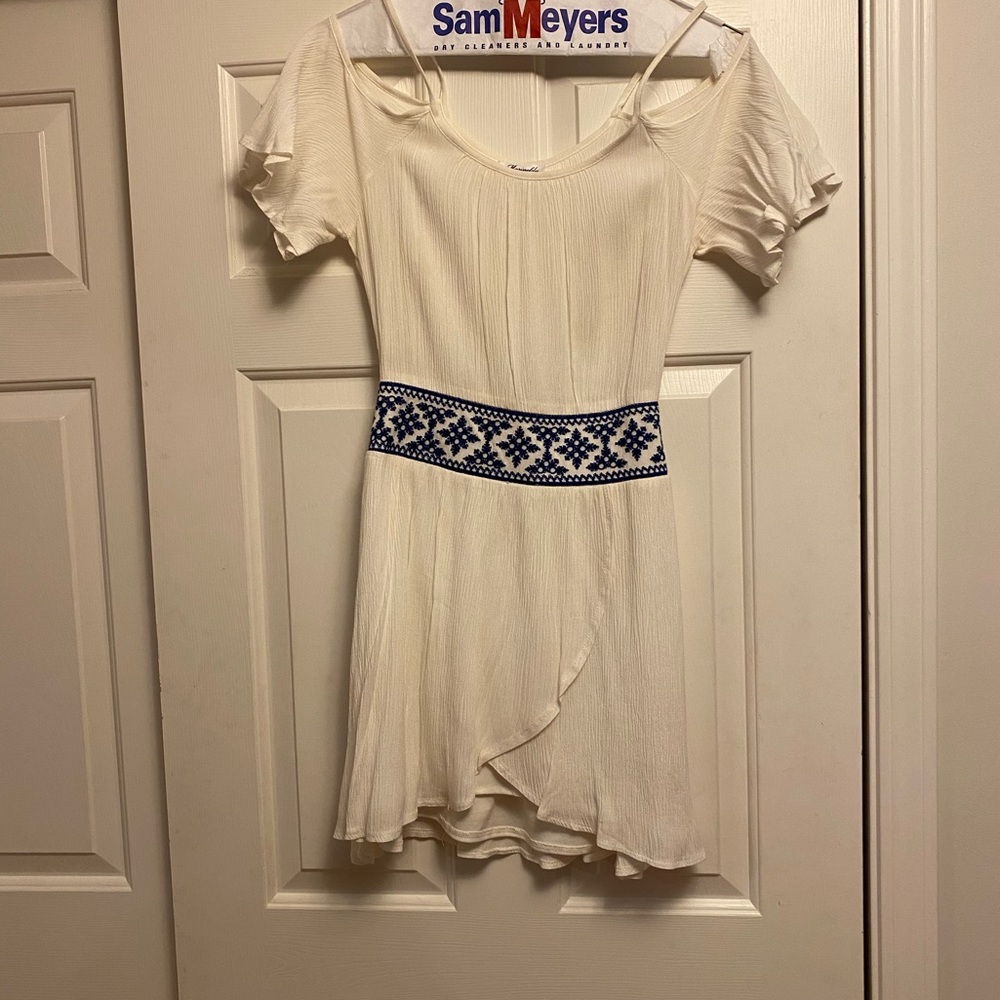 White linen dress with blue stitching detail